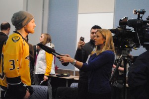 WKRN's Dawn Davenport interviewing Nashville Predators Colin Wilson at STARS news conference. 